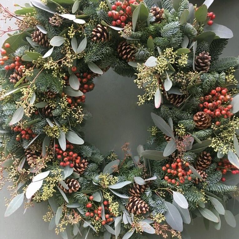 The Elizabeth Christmas door wreath Sample of The Luxury Elizabeth Christmas door wreath a pine and mix festive foliage door wreath available to order from Kensington flowers London