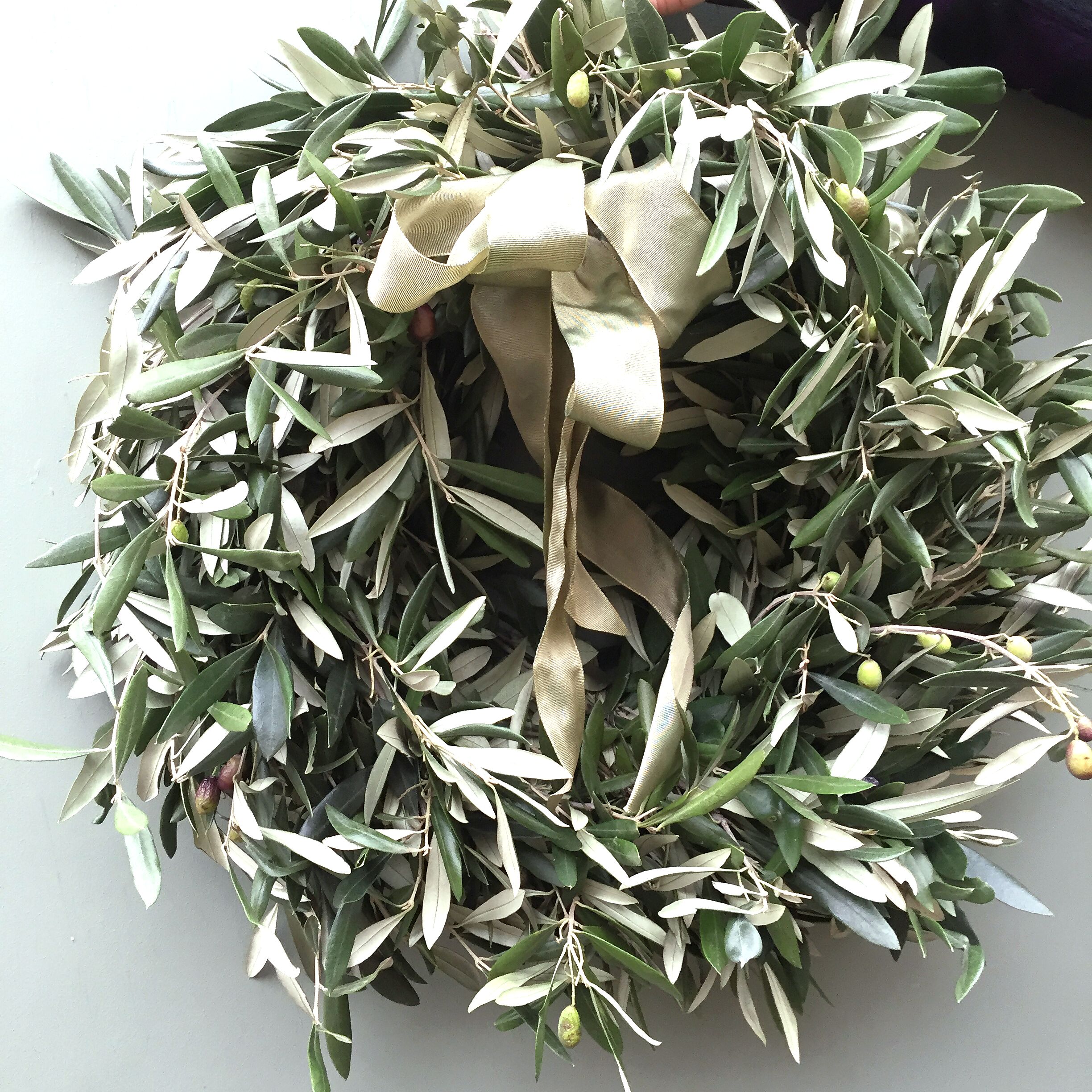 The George Christmas wreath Sample of The Luxury George Christmas door wreath, simply olive foliage luxury wreath available to order from Kensington flowers London